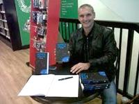 Local author Stuart Olds signs copies of his debut novel, Hope's Truth